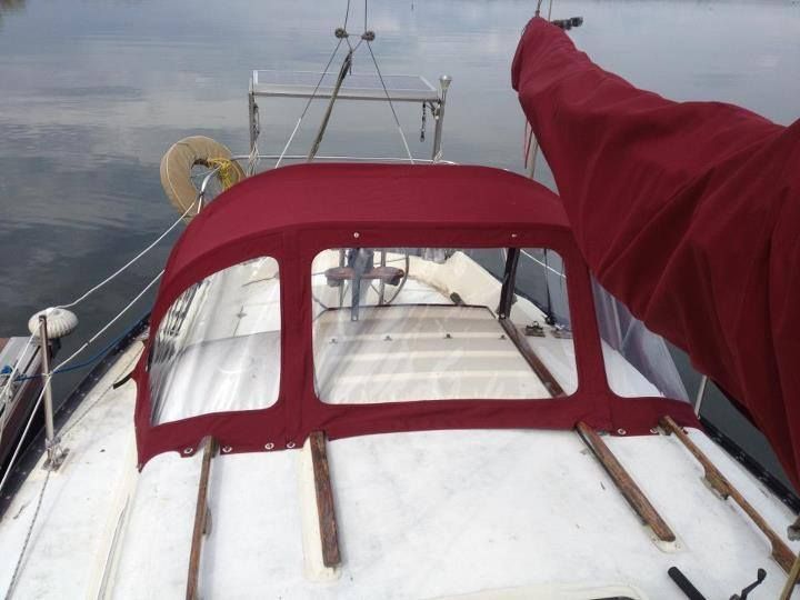 A boat with a red canopy on top of it