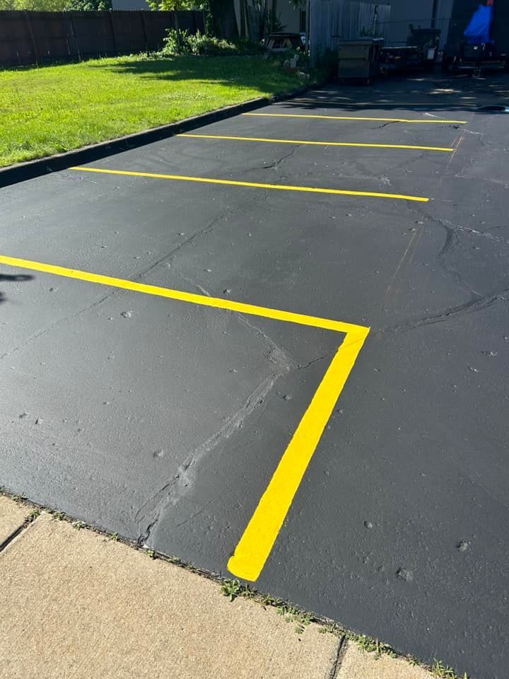 A parking lot with yellow lines painted on it.