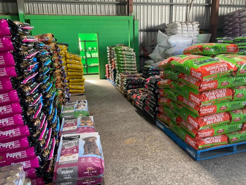 A Warehouse Filled With Lots Of Bags Of Dog Food — SF Produce In Paget, QLD