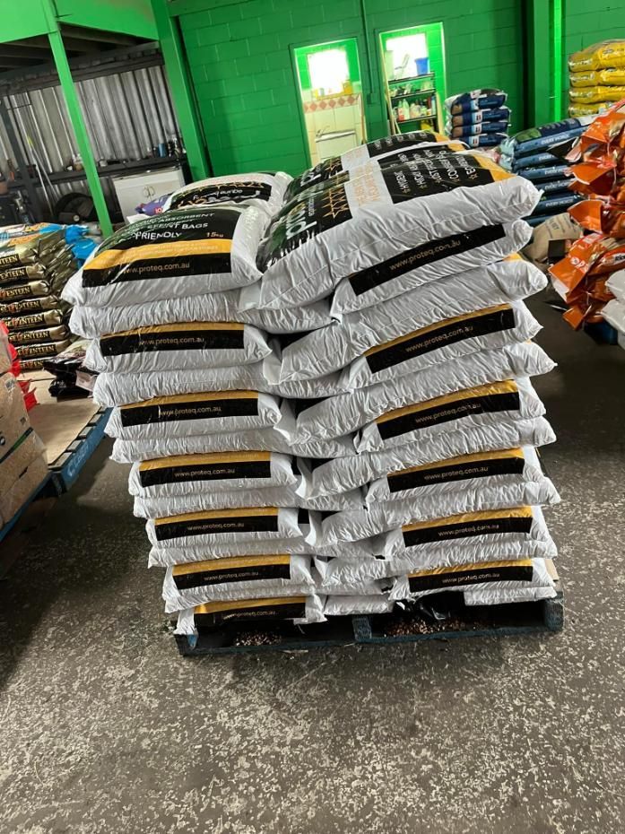 A Pile Of Bags Stacked On Top Of Each Other On A Pallet In A Warehouse — SF Produce In Sarina, QLD
