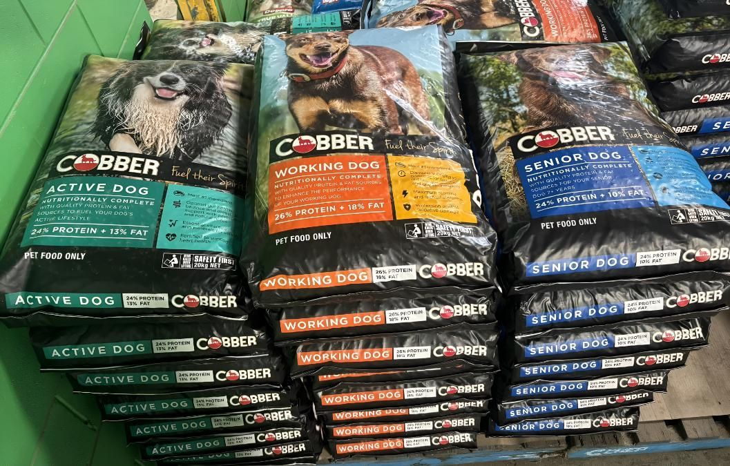 Three Bags Of Dog Food Are Stacked On Top Of Each Other On A Shelf — SF Produce In Proserpine, QLD