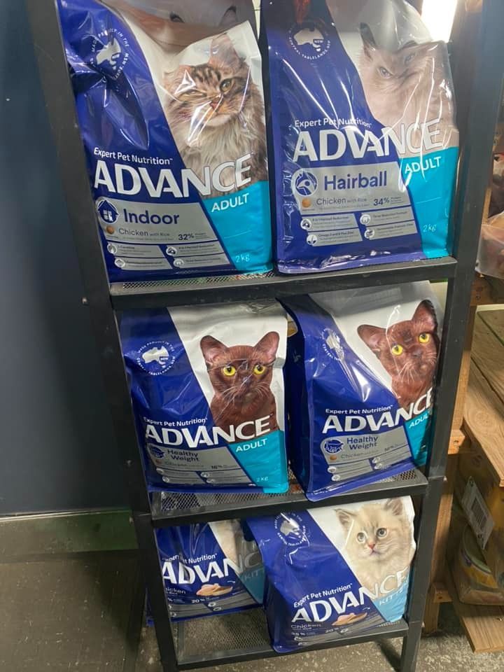 A Shelf Filled With Bags Of Advance Cat Food — SF Produce In Paget, QLD