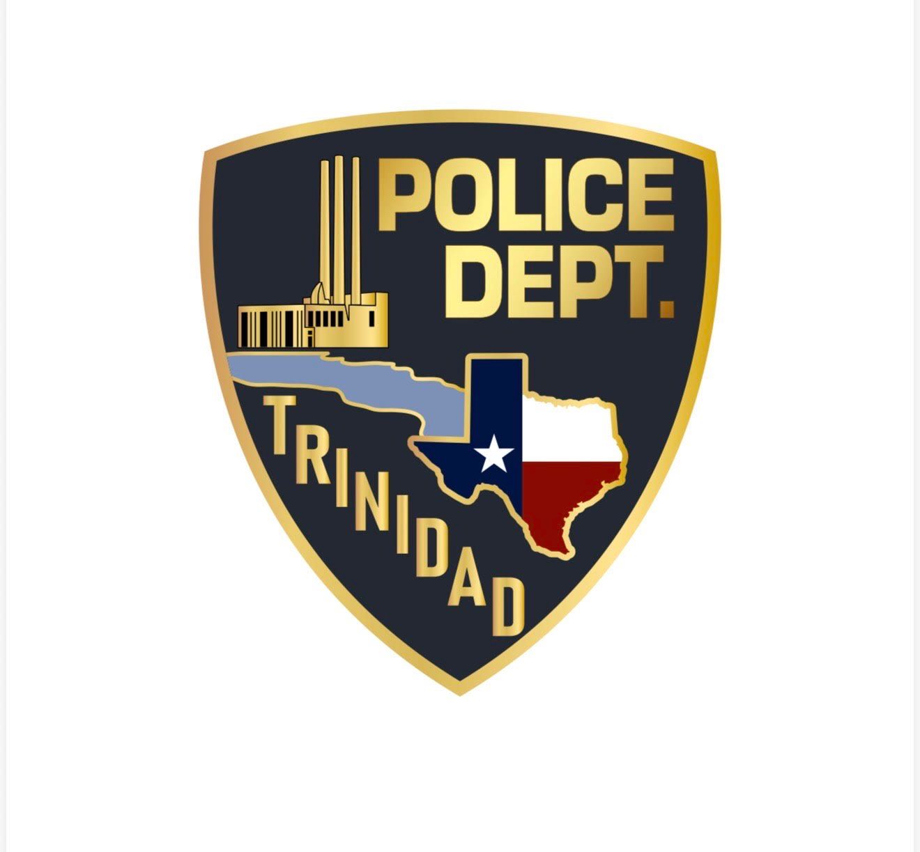 Trinidad Police Department badge: Shield with Texas outline, building, and 