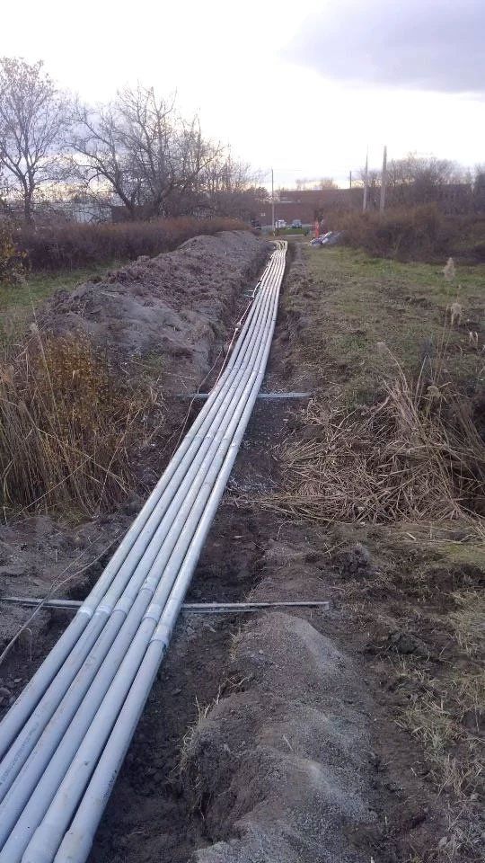 electrical cables running through trench in ground