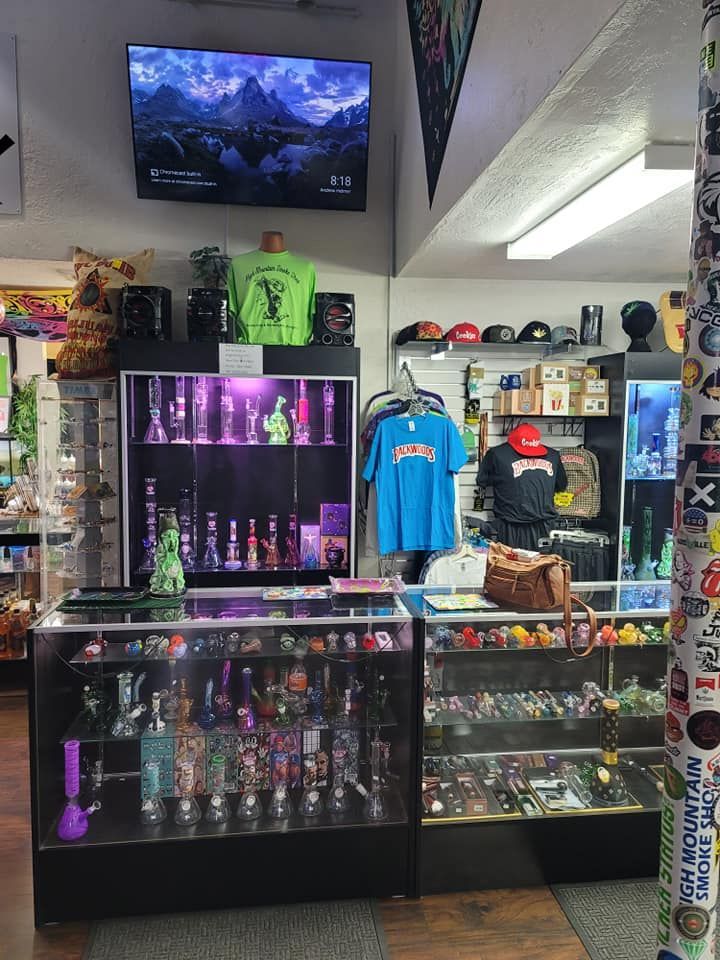 A store filled with lots of items and a television on the wall.