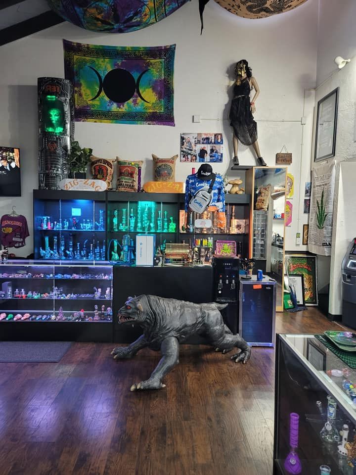 A room with a statue of a wolf in the middle of it