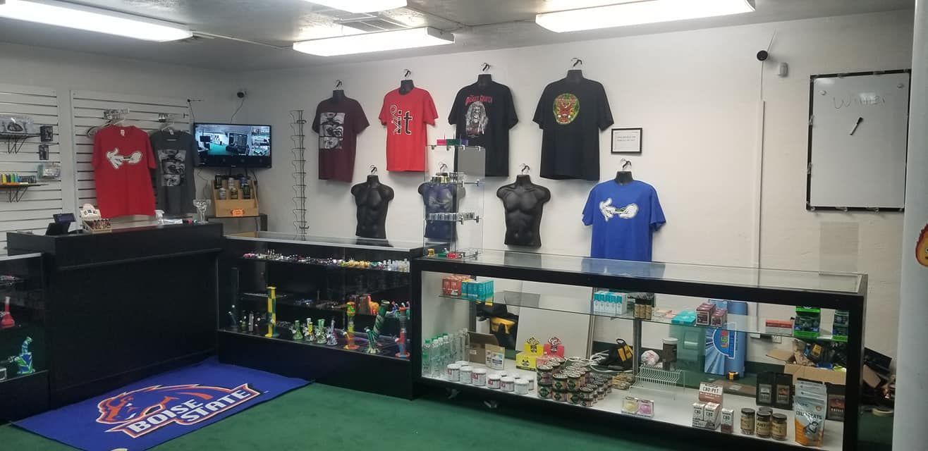 A store with a lot of shirts hanging on the wall.