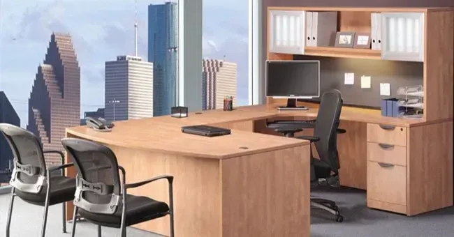 An Office with Two Chairs and A Desk with A Computer on It