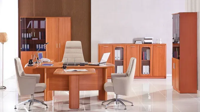 An Office with A Desk, Chairs, Cabinets and A Laptop on The Desk