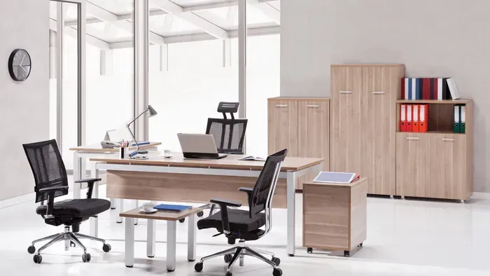 An Office with A Desk, Chairs, Cabinets, and A Laptop