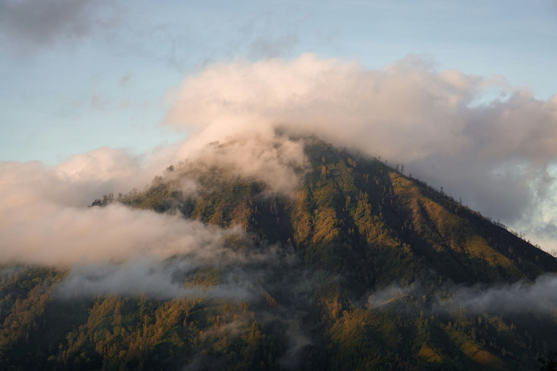 A mountaintop covered in white clouds