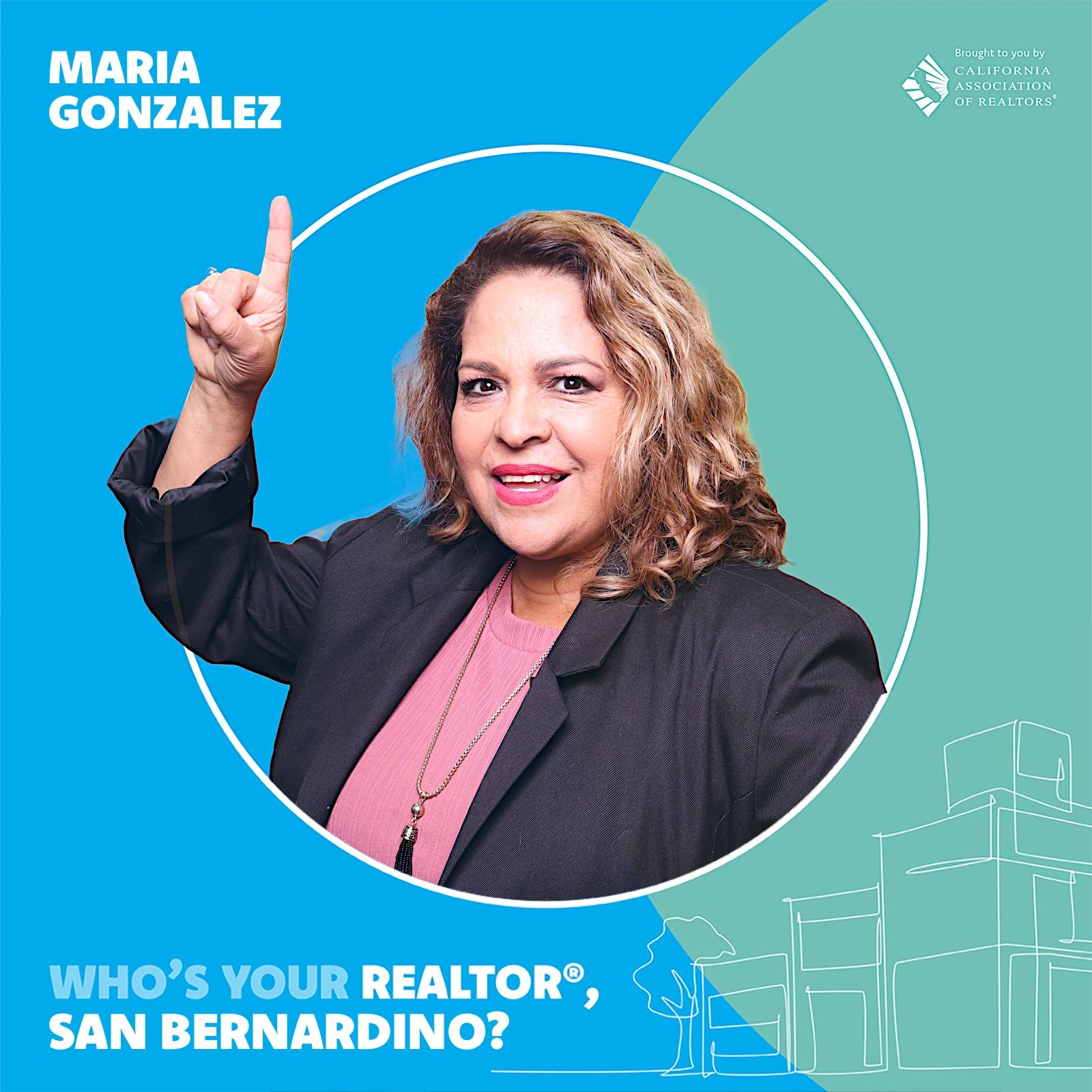 A woman is sitting at a desk with a laptop and a vase of flowers.