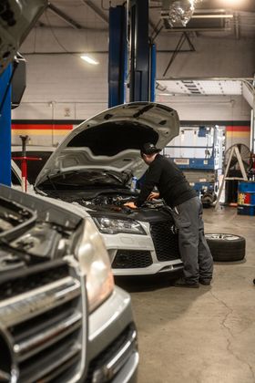 S&S Bavarian Auto Mechanic inspecting car