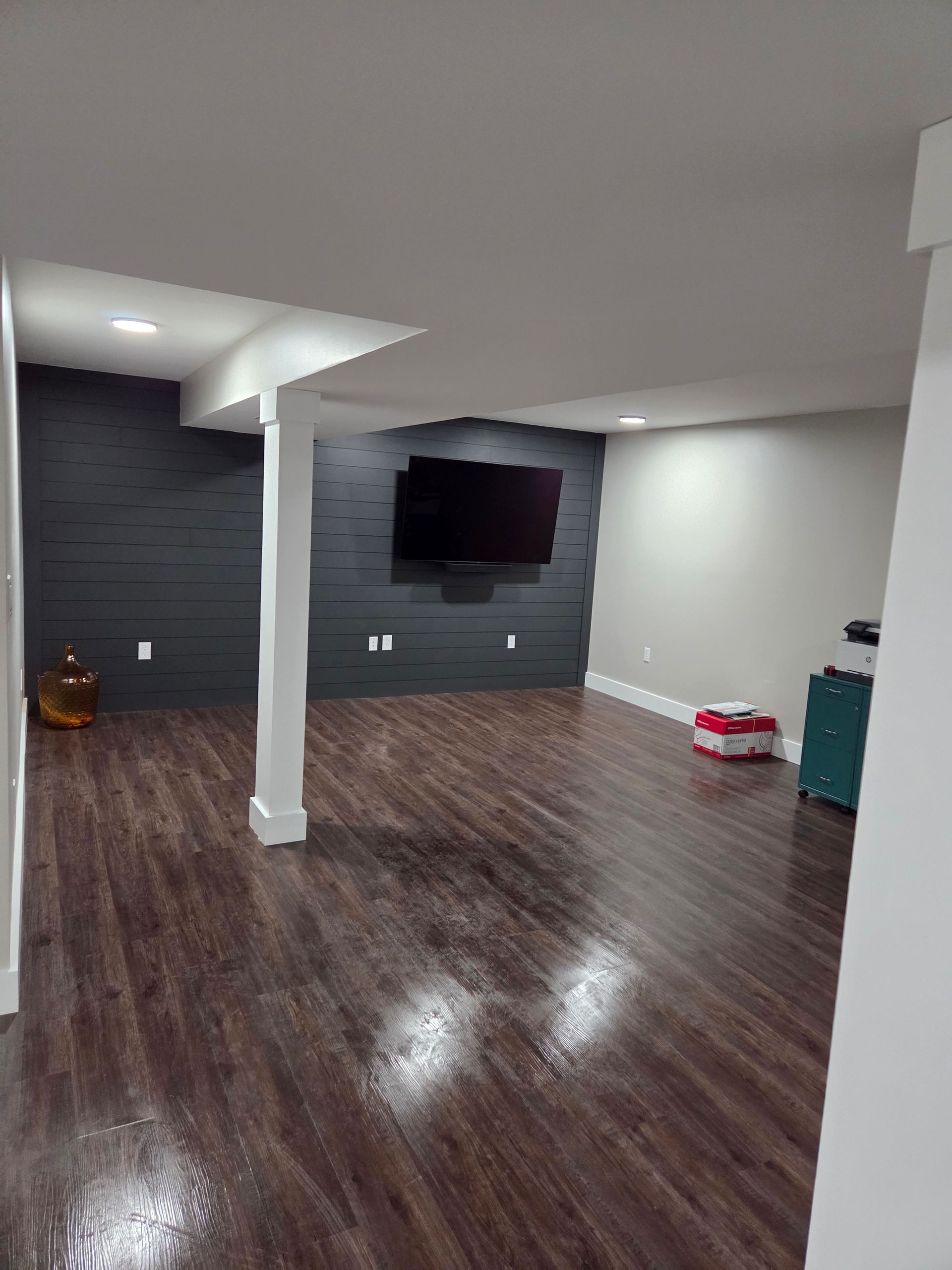 A man is hammering nails into a piece of wood.