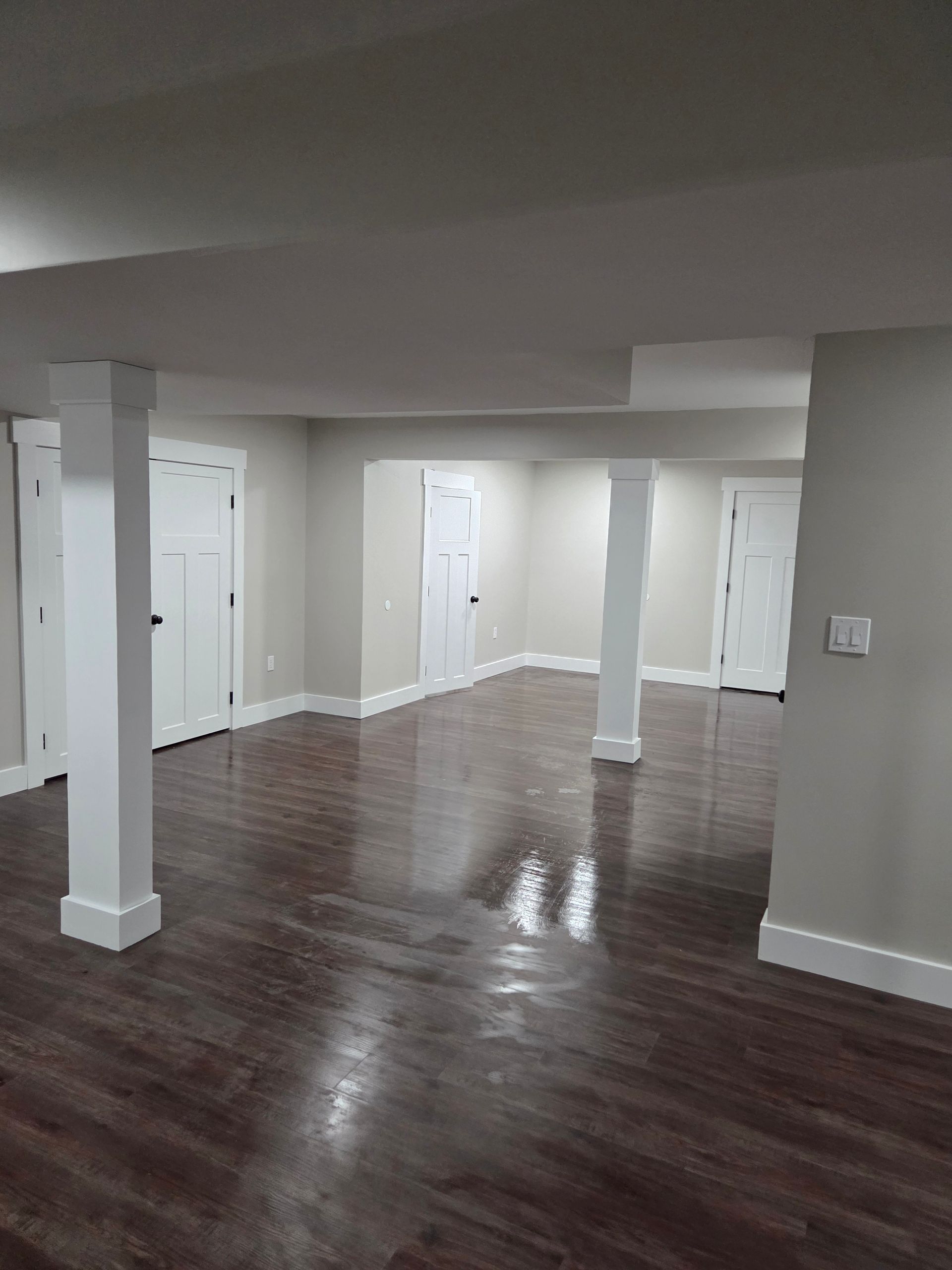 A man is using a jigsaw to cut a piece of wood.