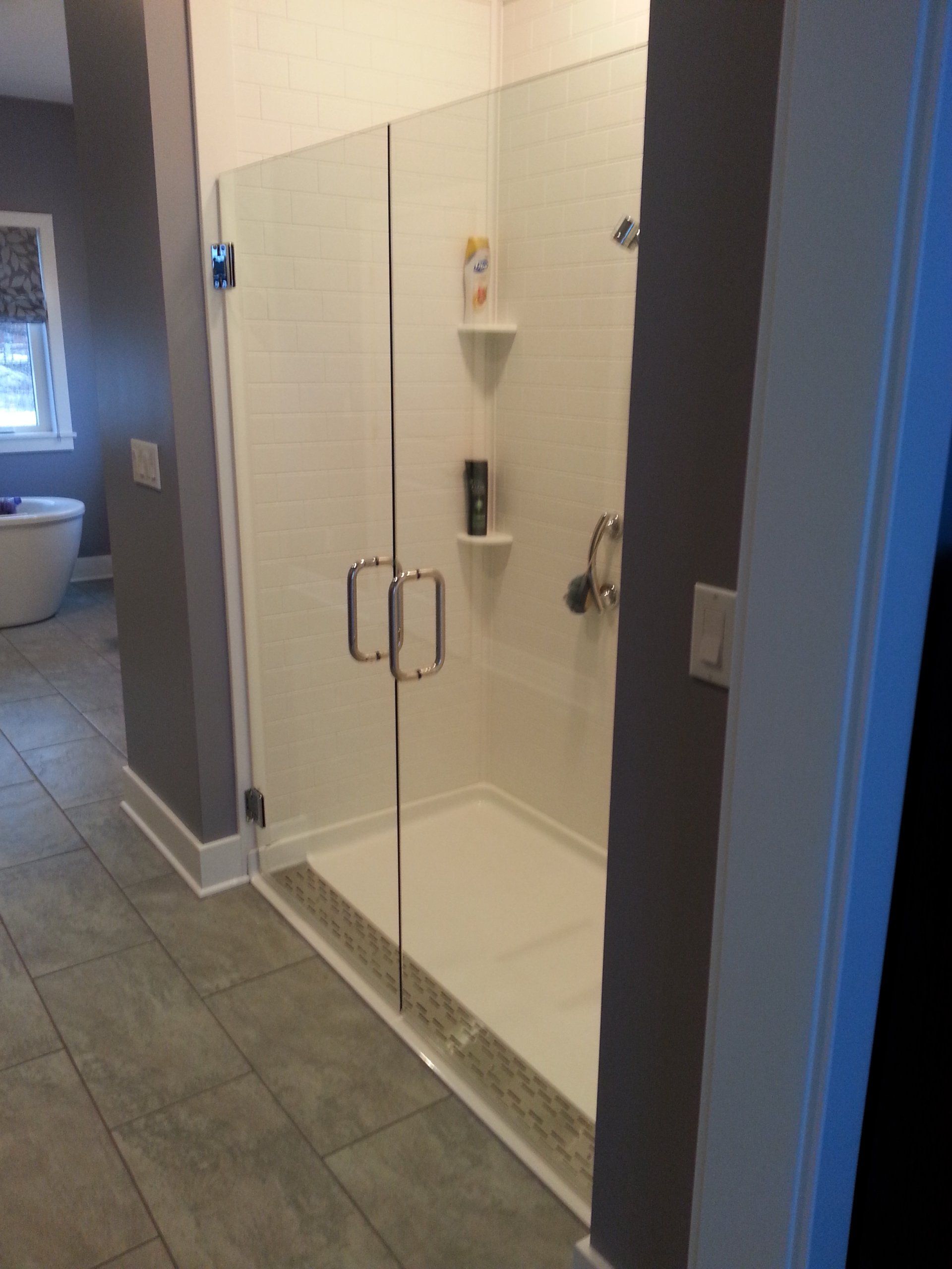 Shower with glass door — Closets & Closet Accessories in Erie, PA
