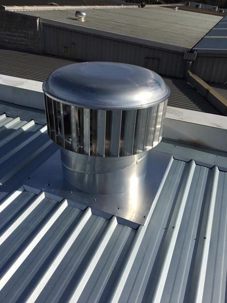 Top view of metal roof replacement  with air vent