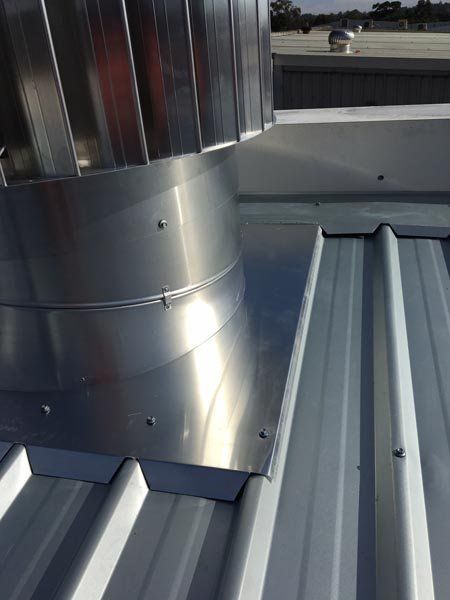 Top view of metal roof replacement  with air vent