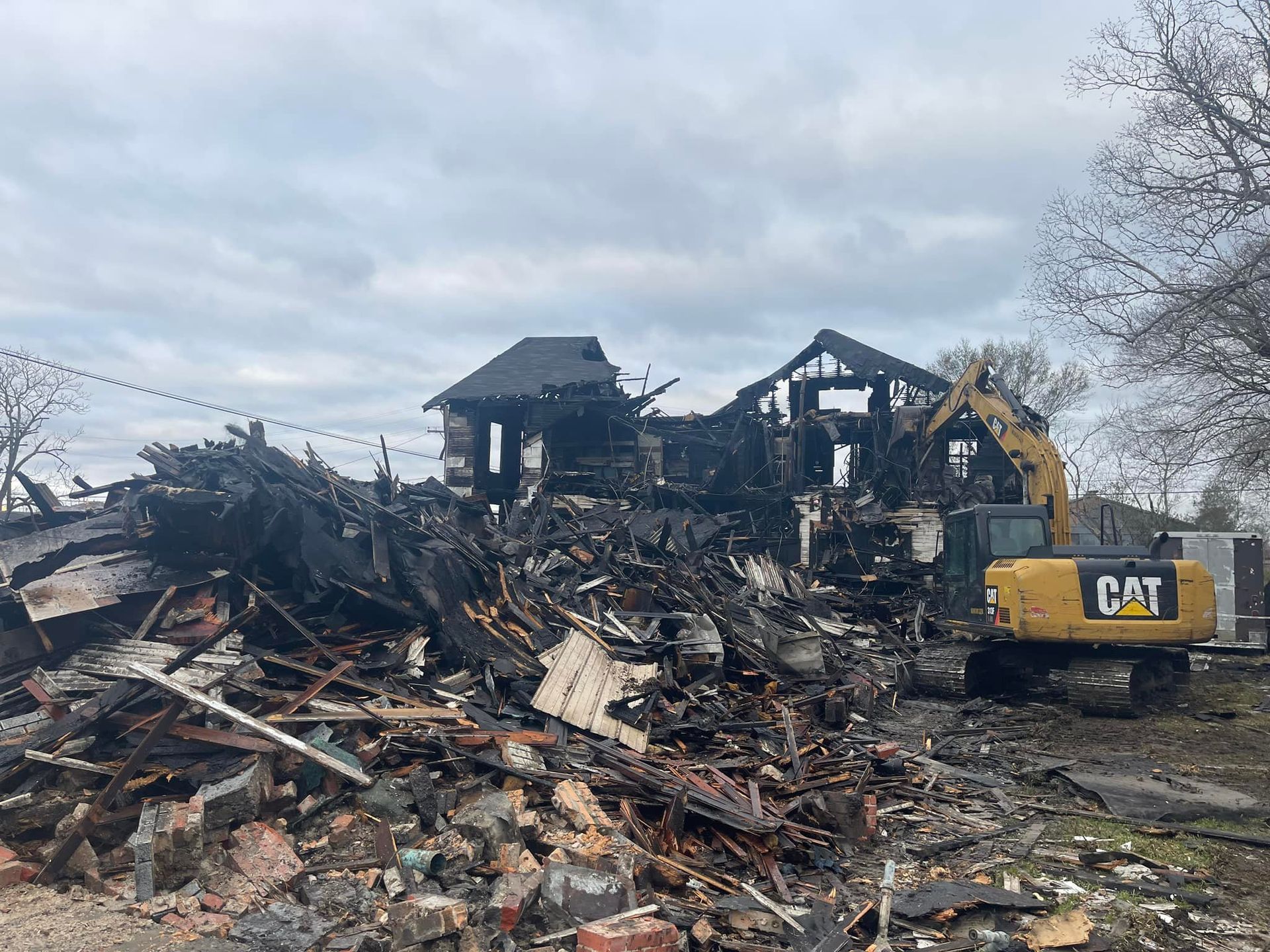 A fire damage house is being demolished.