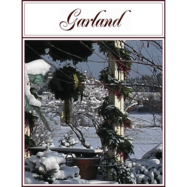 Snowy porch decorated with garland and wreaths beneath a “Garland” sign