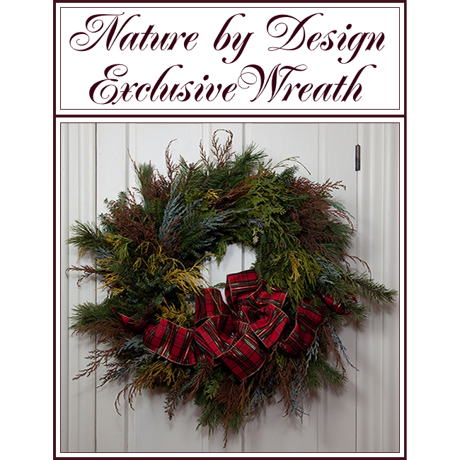 Decorative evergreen wreath with red ribbon on a white door, under the text “Nature by Design Exclusive Wreath”