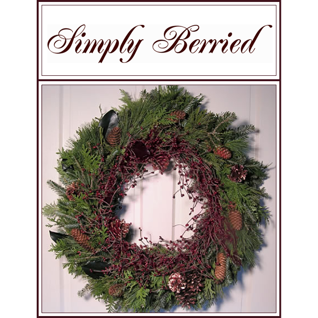 “Simply Berried” wreath of green pine and red berry branches on a white background