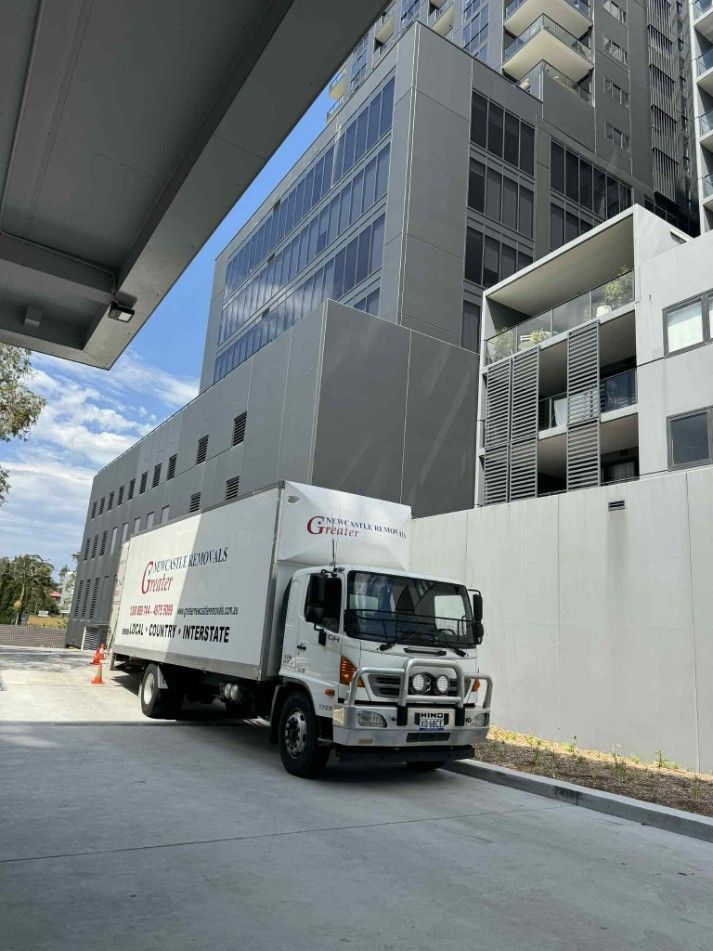 A Removalist Truck Outside A Building