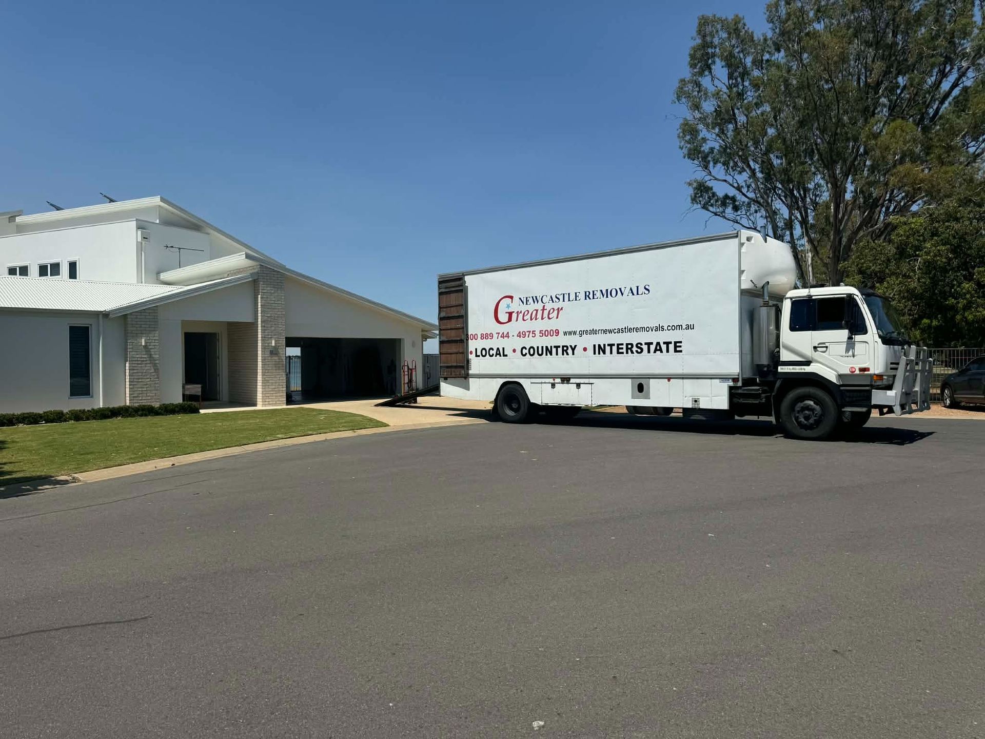 Removalist Truck Waiting Outside a White House