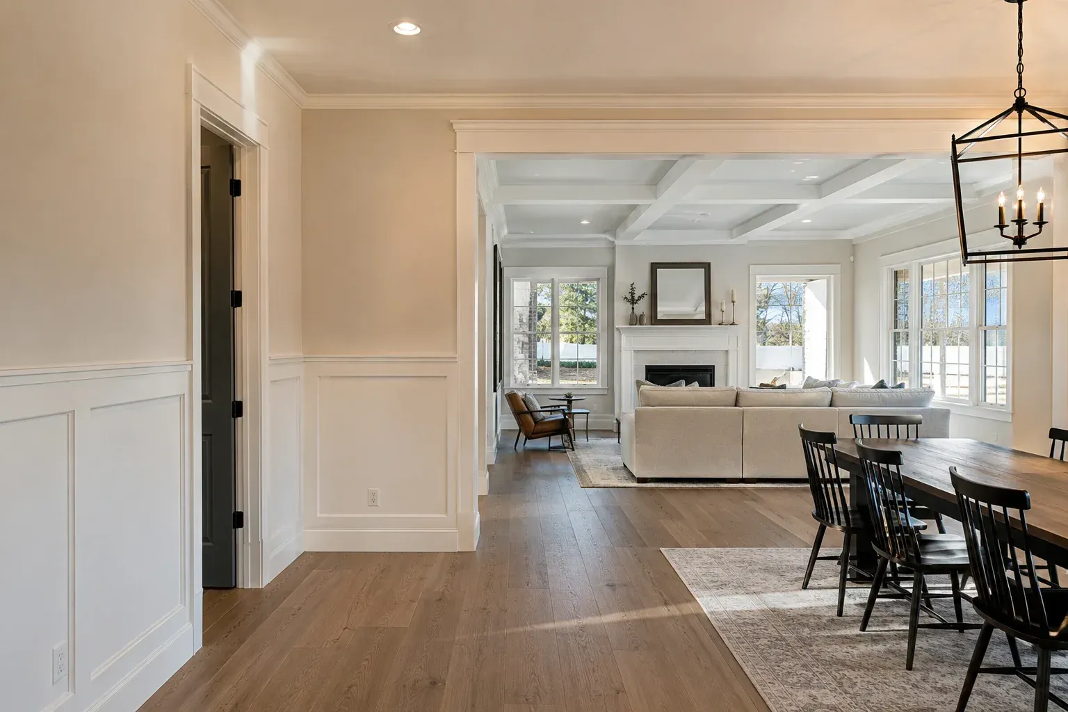 Carpenter crafting detailed wood trim, showing how much does custom trim work cost in a home.