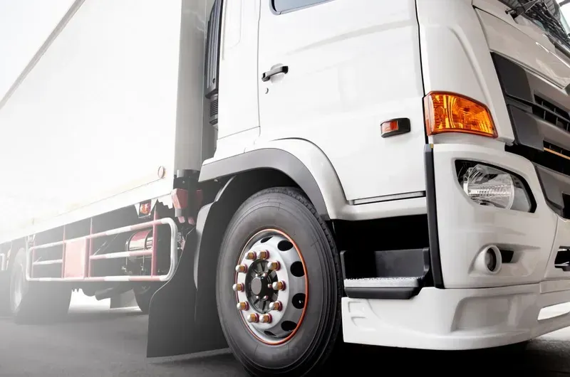 White Semi-truck Parked, Angled View of Front Tire and Cab — Advanced Auto Electrics & Mechanical in Innisfail, QLD