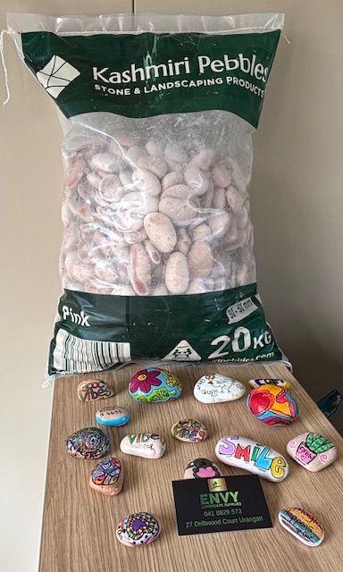 A Lush Green Garden With A Wooden Pergola And A Wooden Archway — Envy Landscape Supplies In Urangan, QLD