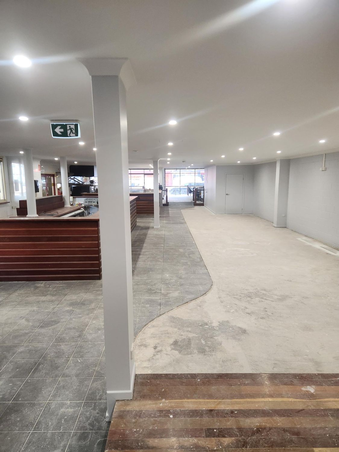 Interior View of a Room Under Renovation, With Exposed Floors and Pillars — Red Emperor Constructions in Cannonvale, QLD