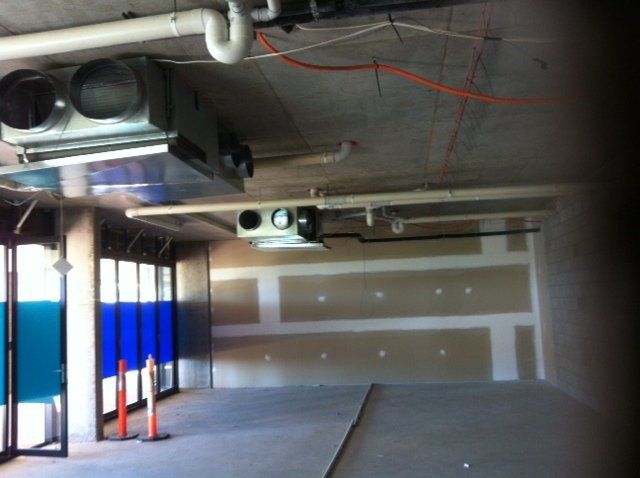 A room with a lot of wires hanging from the ceiling — Red Emperor Constructions in Cannonvale, QLD