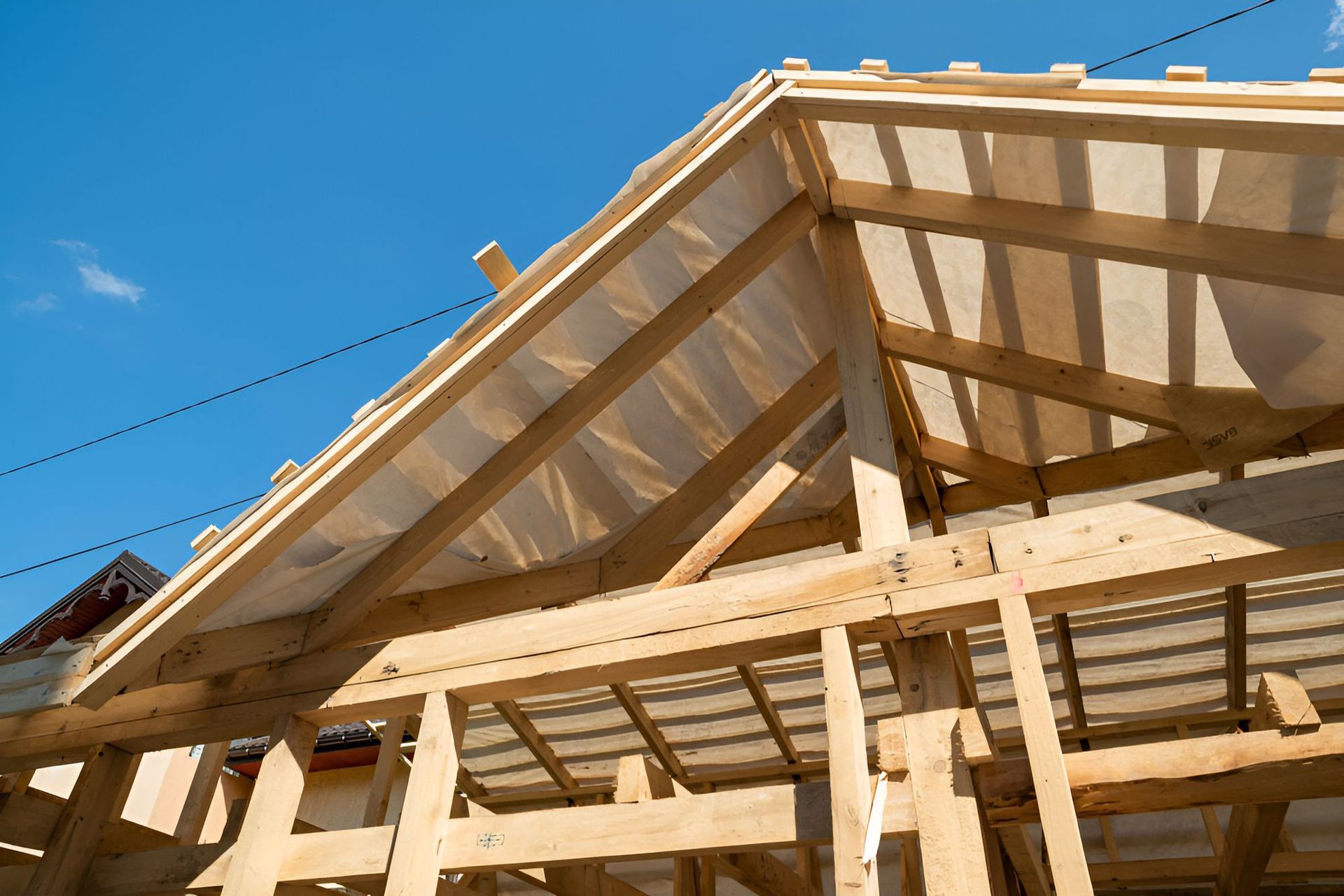 A wooden structure under construction with a clear plastic roof — Red Emperor Constructions in Cannonvale, QLD