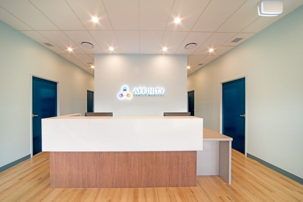 There is a reception desk in the middle of the room — Red Emperor Constructions in Cannonvale, QLD