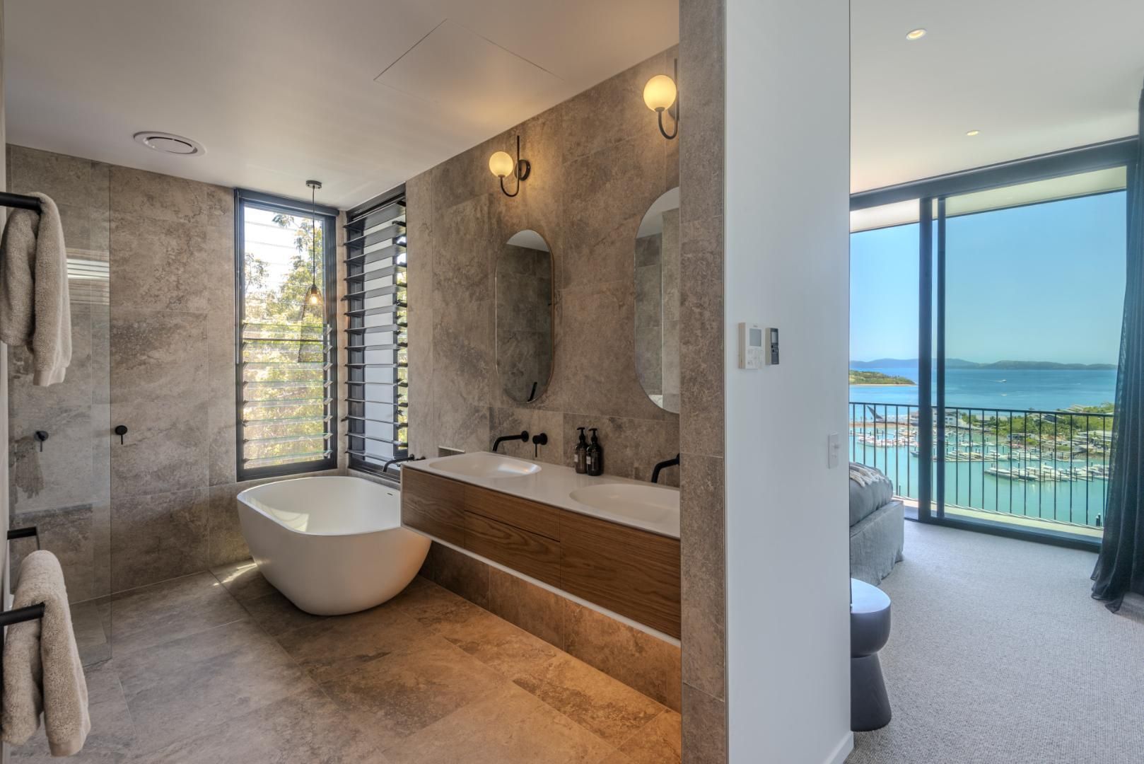 Bathroom With a Modern Design, Featuring a Bathtub, Double Vanity — Red Emperor Constructions in Cannonvale, QLD