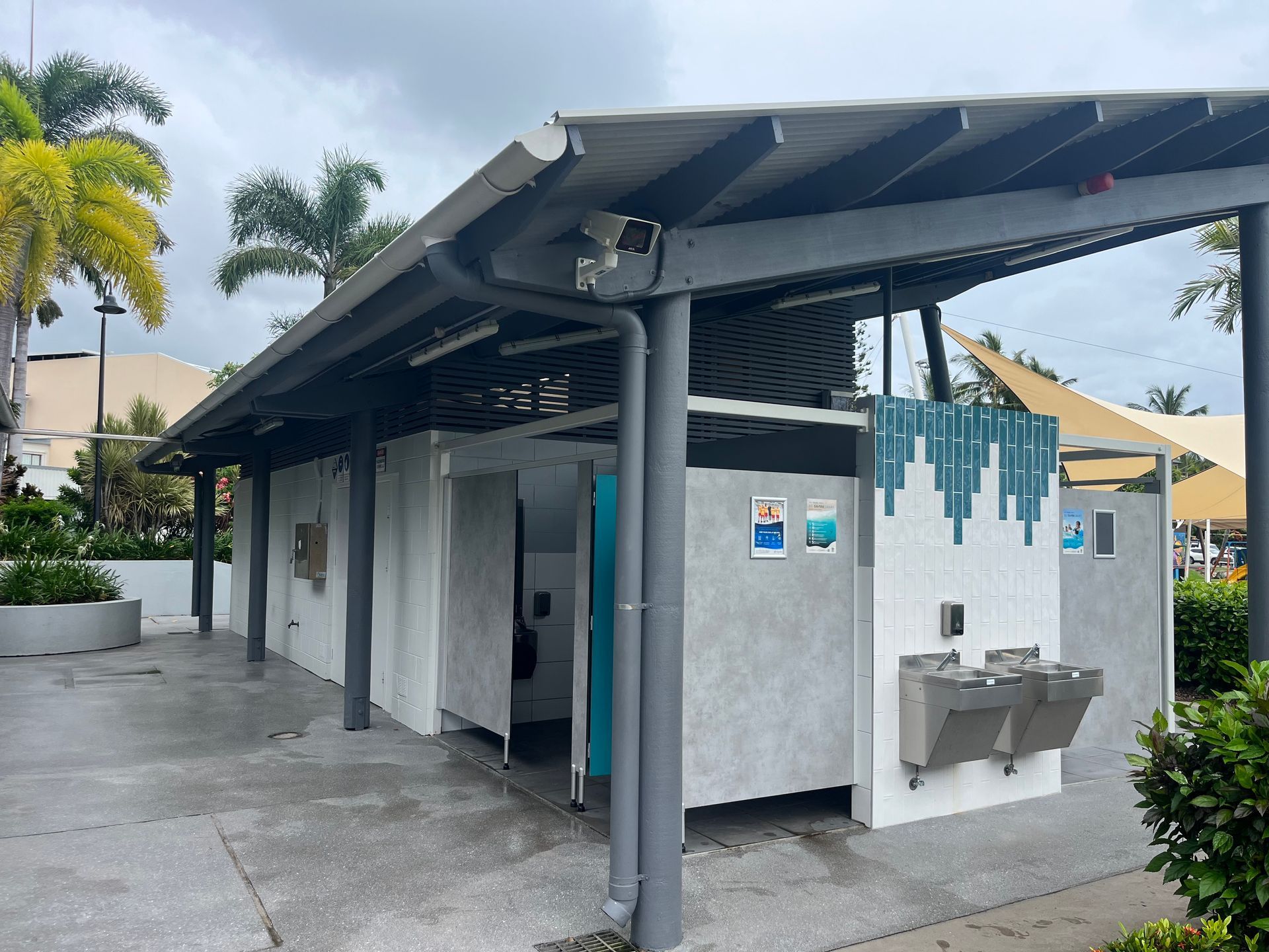 Public Restroom Building With a Gray Roof, Concrete Walls, and Open Doors — Red Emperor Constructions in Cannonvale, QLD