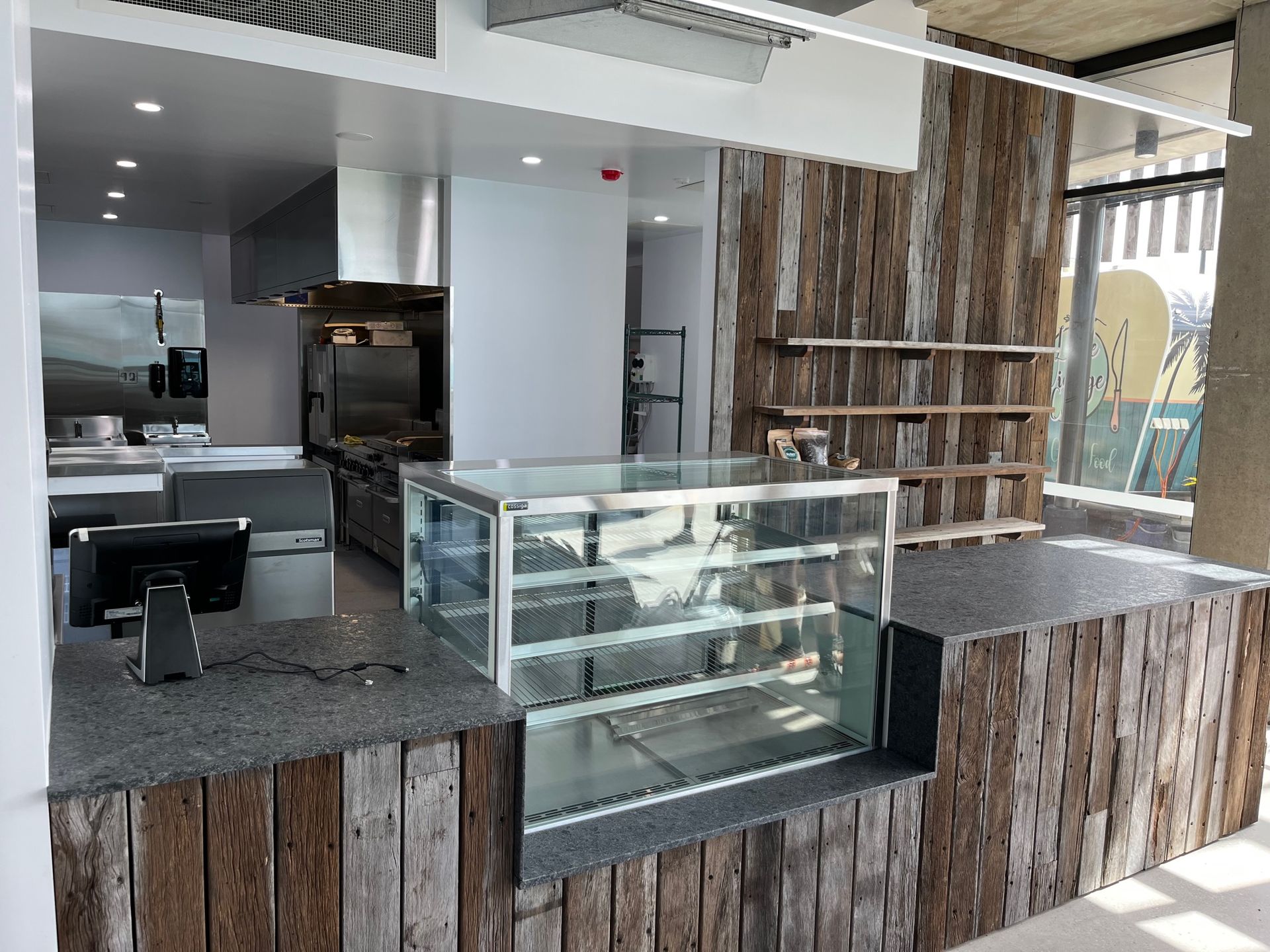 Interior of a Cafe, Stainless Steel Kitchen With Counter — Red Emperor Constructions in Cannonvale, QLD