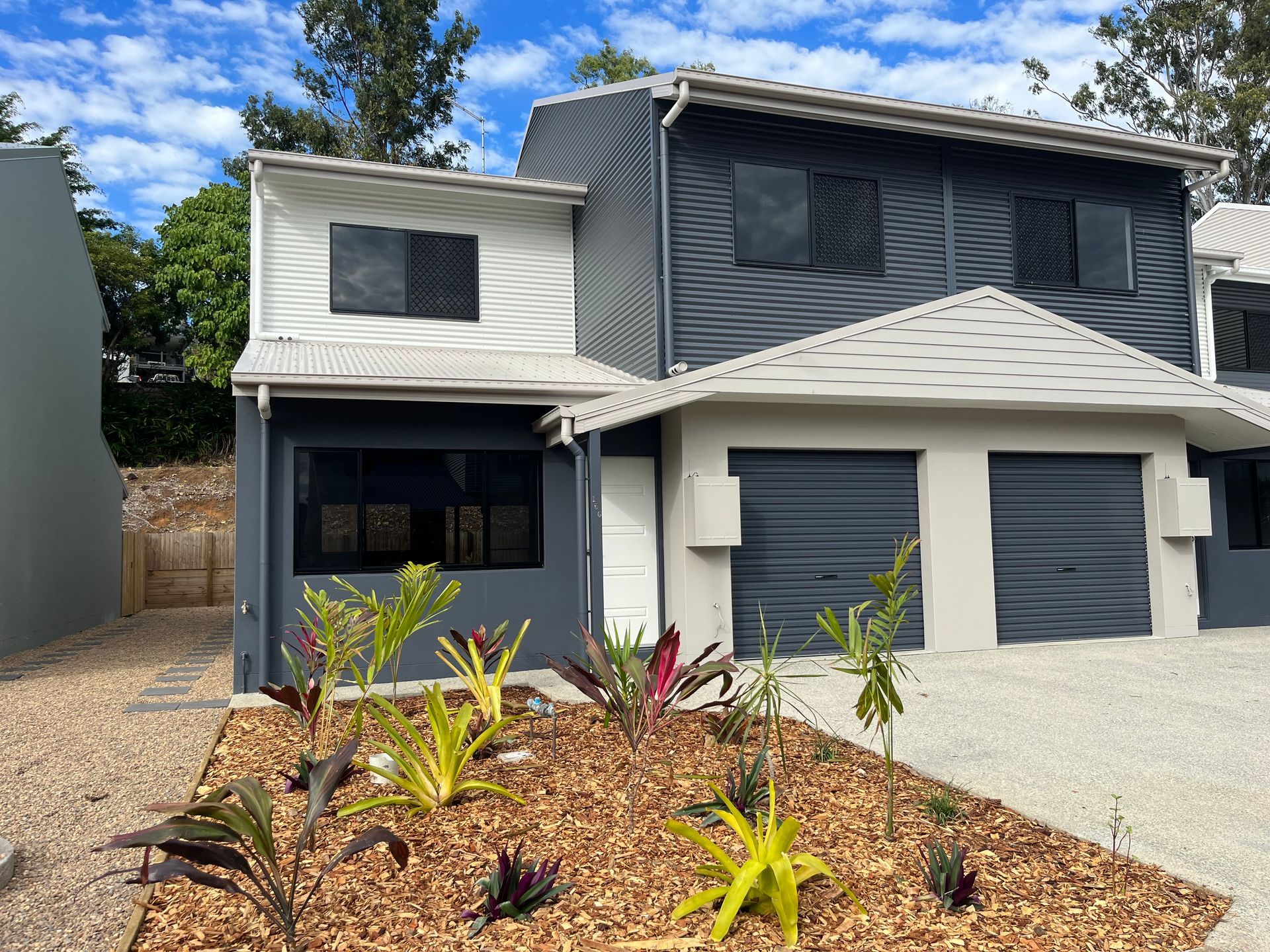 Two-story Modern Townhouses With Gray and White Exterior, Two-car Garage — Red Emperor Constructions in Cannonvale, QLD