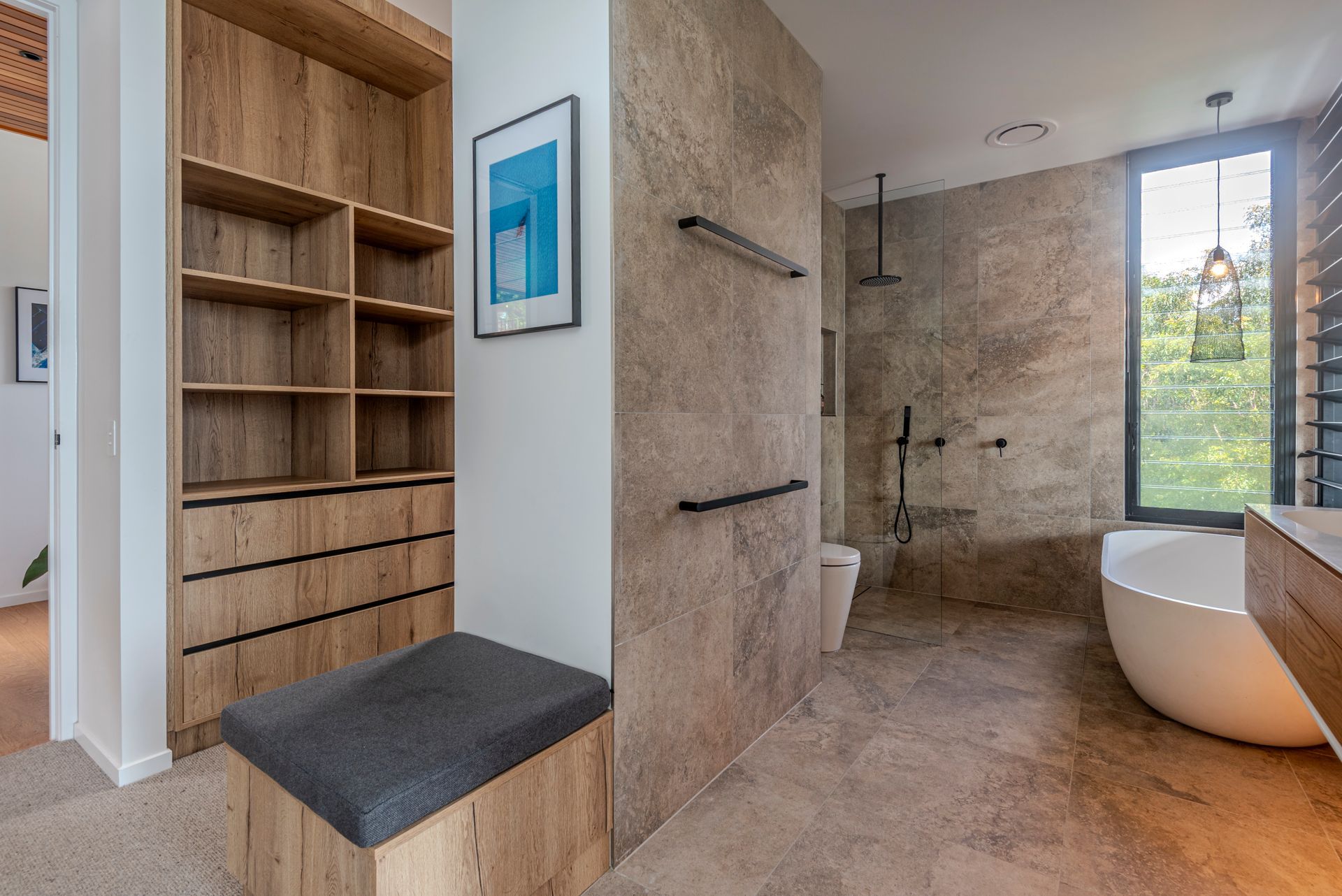Bathroom With Wooden Closet, Stone Walls, a Freestanding Tub — Red Emperor Constructions in Cannonvale, QLD