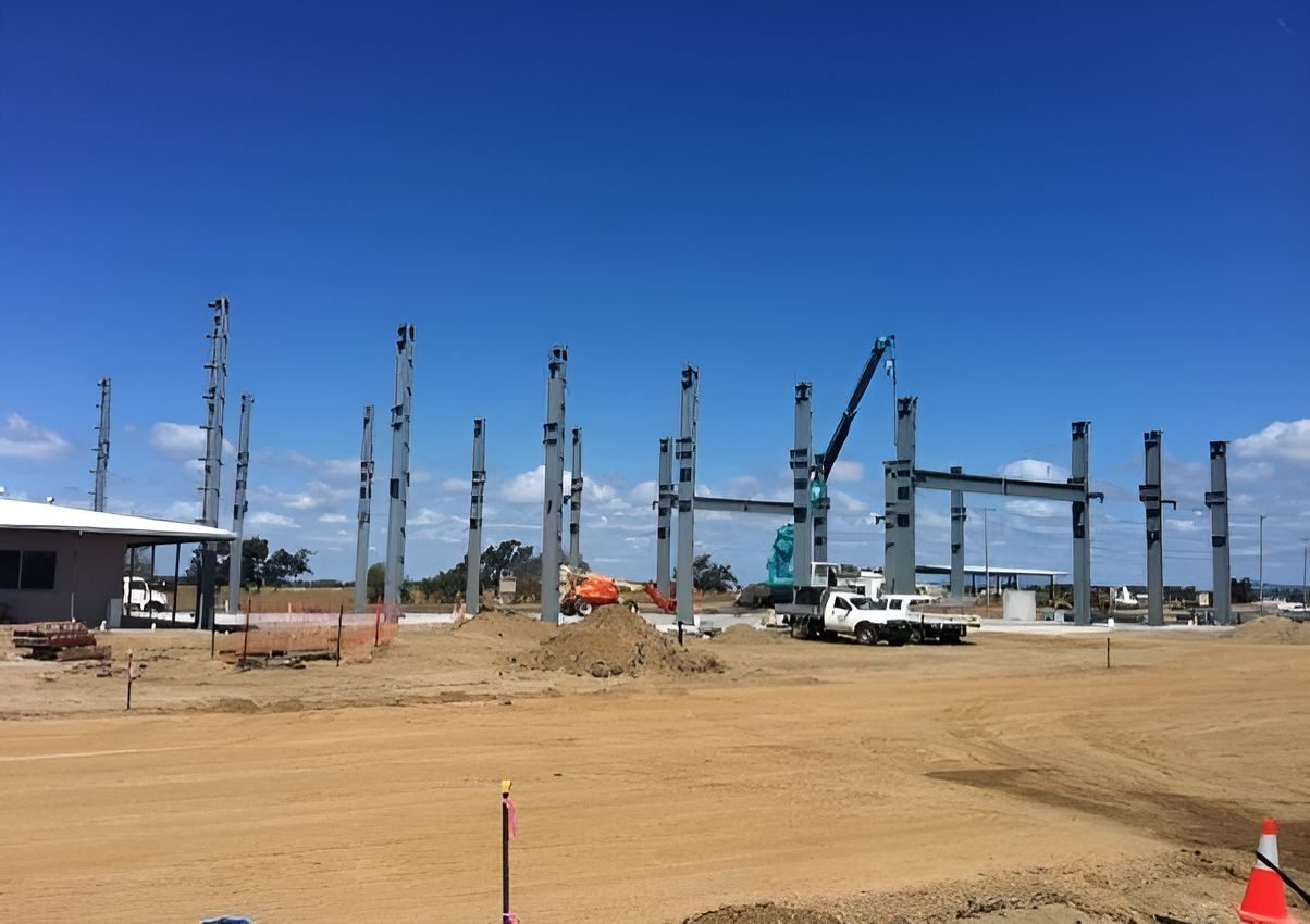 A Large Building is Being Built in the Middle of a Dirt Field — Red Emperor Constructions in Cannonvale, QLD