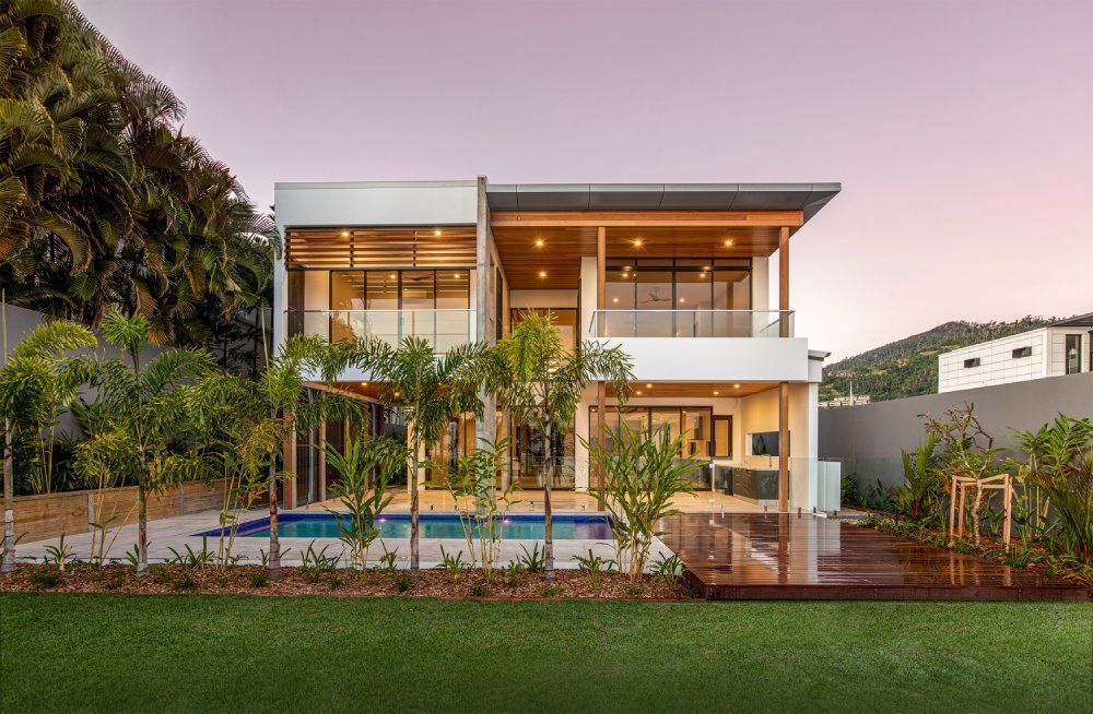 A Large House With a Swimming Pool in the Backyard — Red Emperor Constructions in Cannonvale, QLD