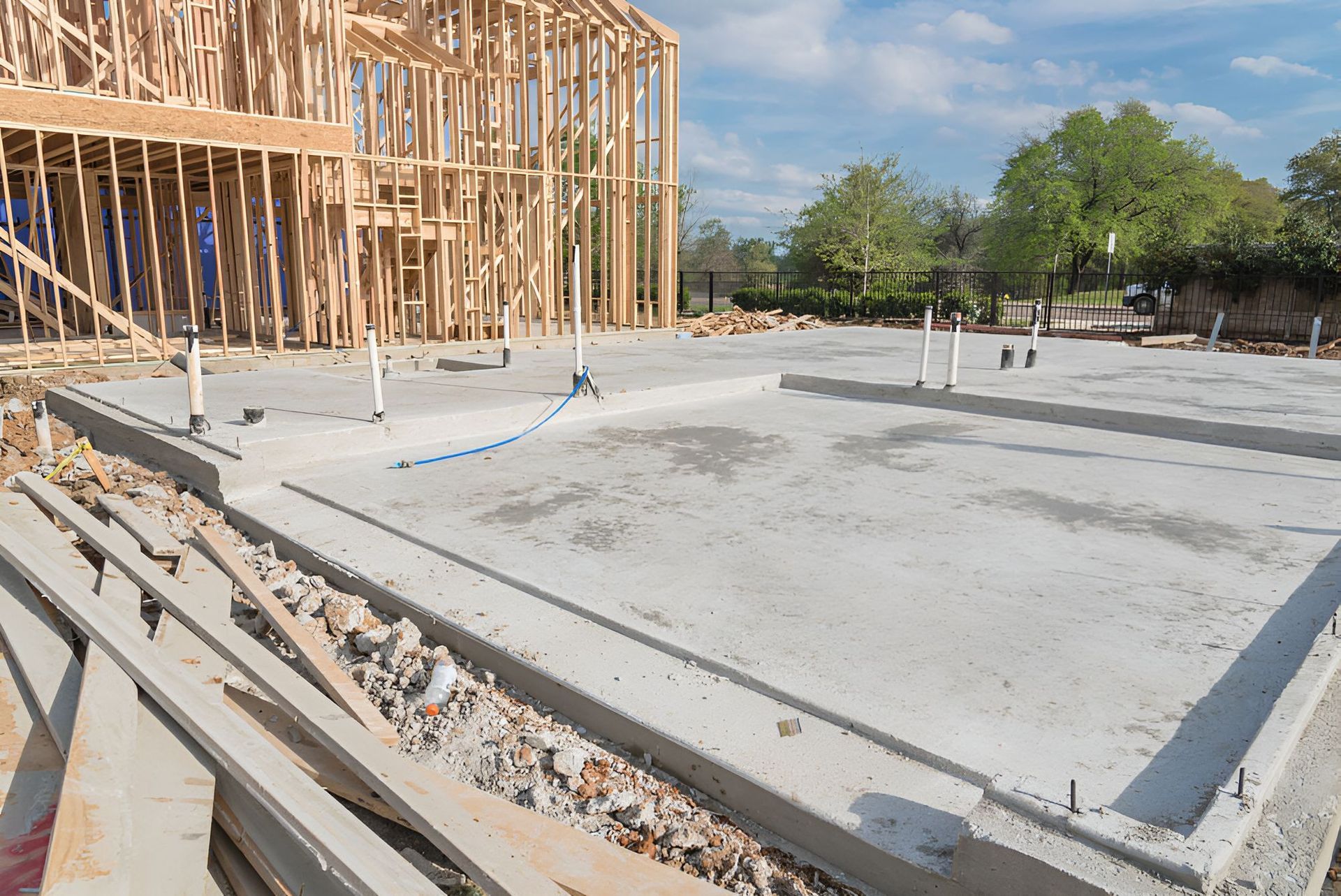 A house is being built with a concrete foundation and a wooden frame — Red Emperor Constructions in Cannonvale, QLD
