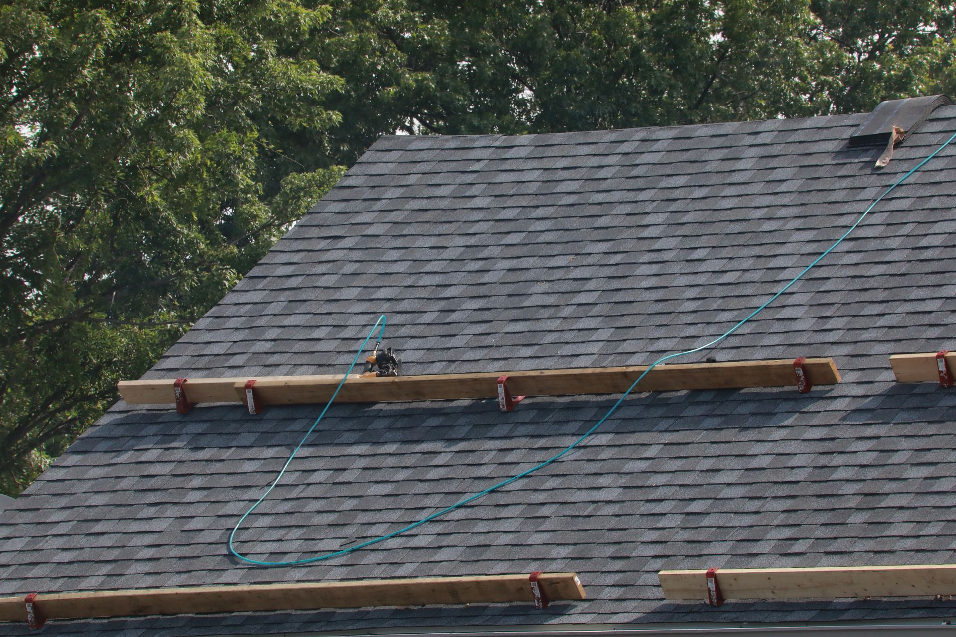 Pitch roof stand set up for roofers to safely work on steep roofing projects.