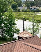 A view of a river from the roof of a house.