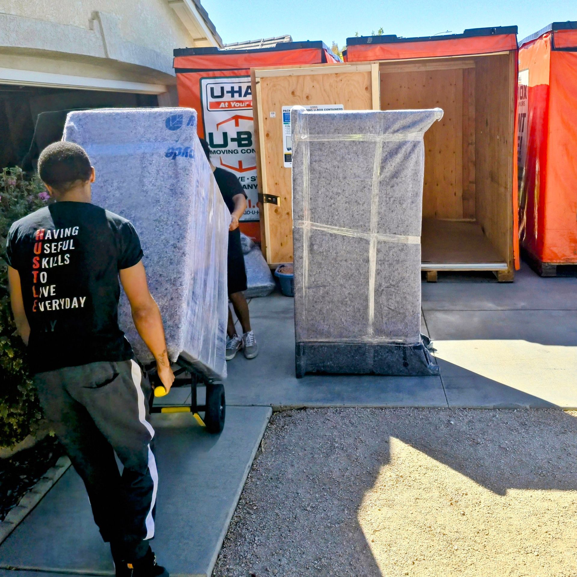 A man wearing a t-shirt that says ' moving ' on it