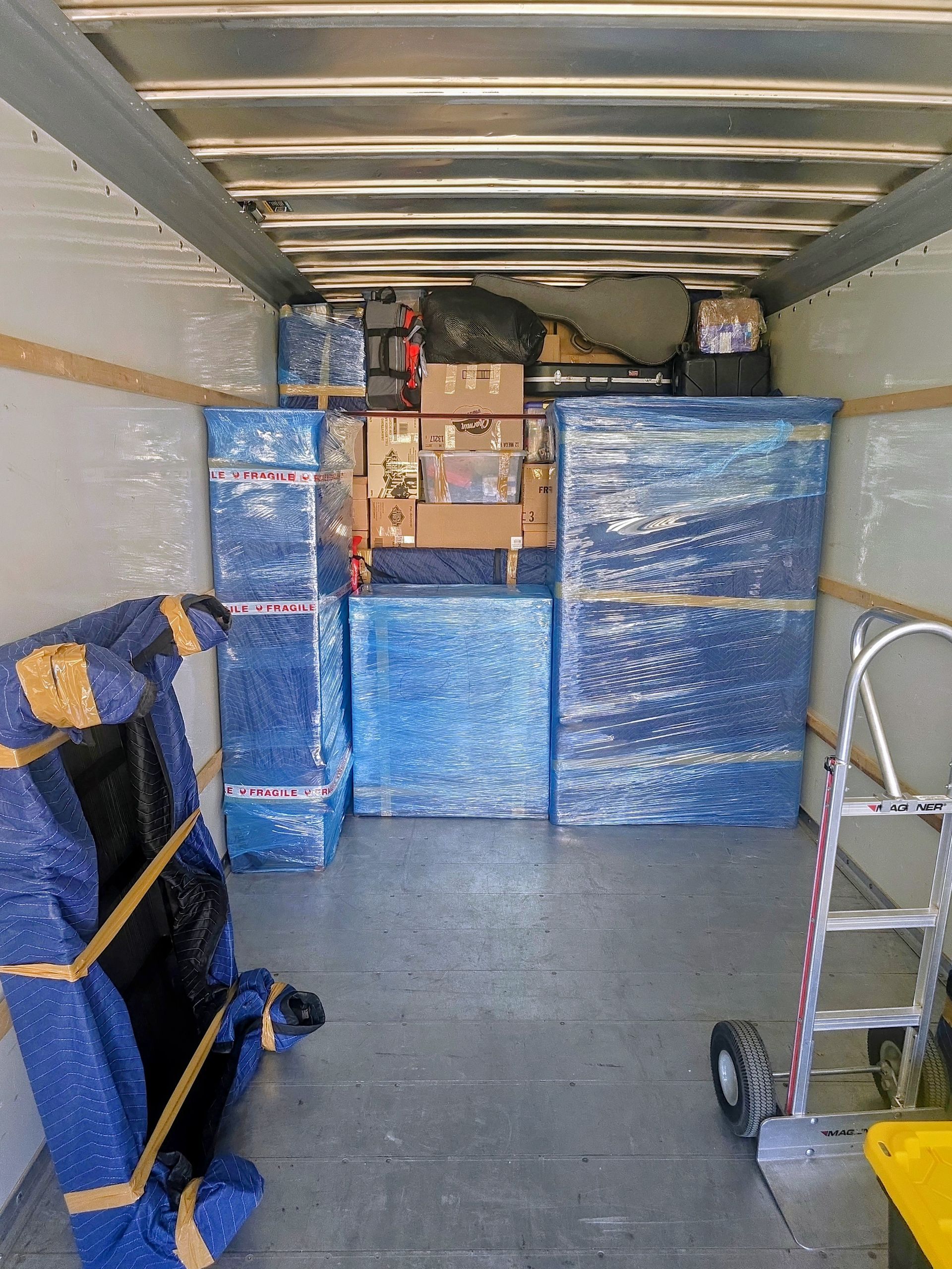 A man wearing a t-shirt that says ' moving ' on it