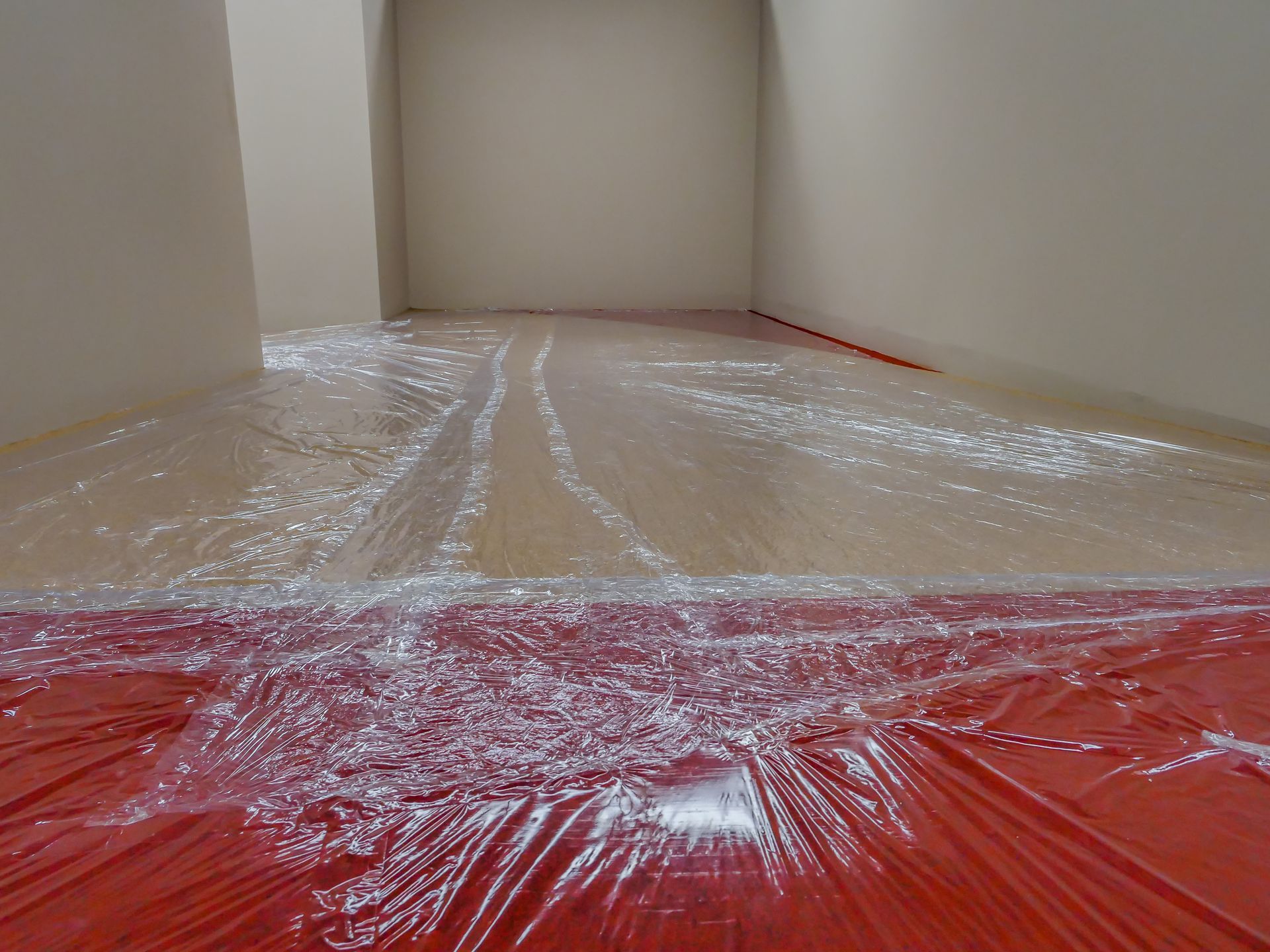 A room with plastic covering the floor and walls