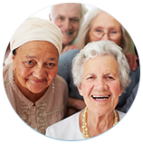 a group of elderly people are smiling for the camera .