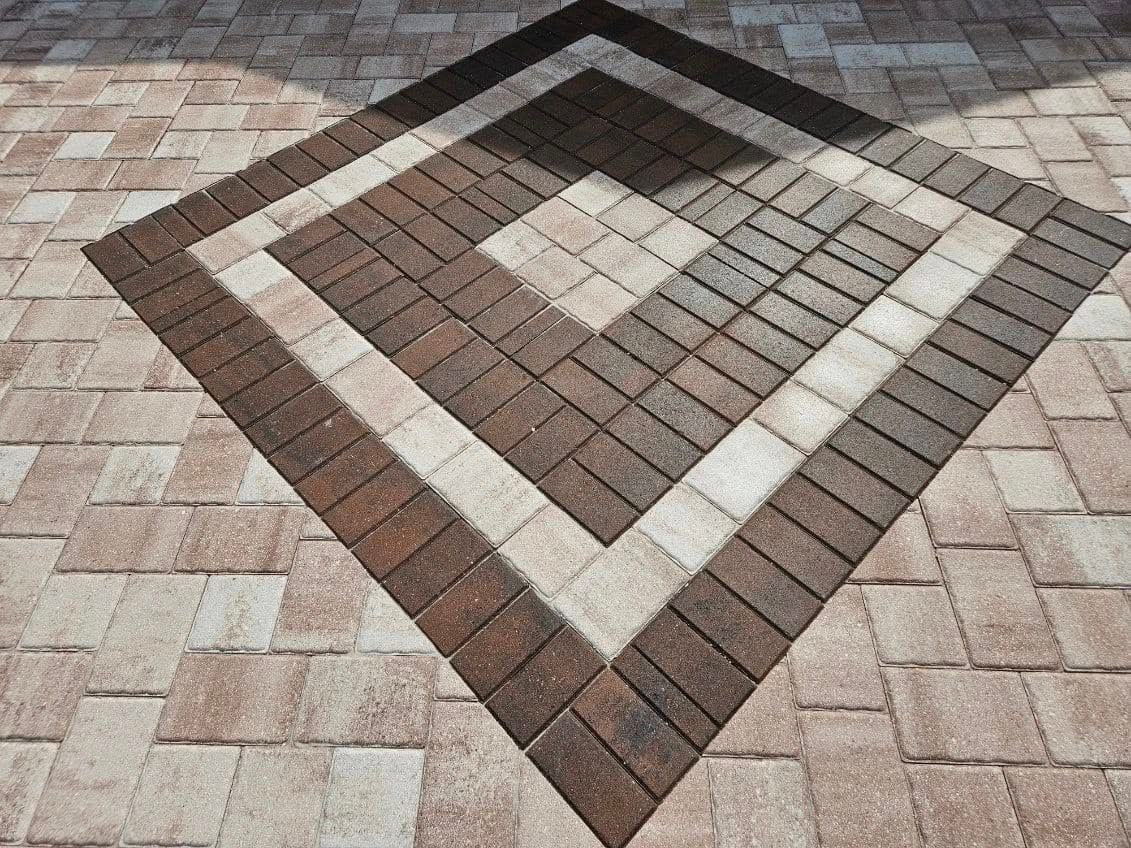 A brick floor with a diamond pattern on it